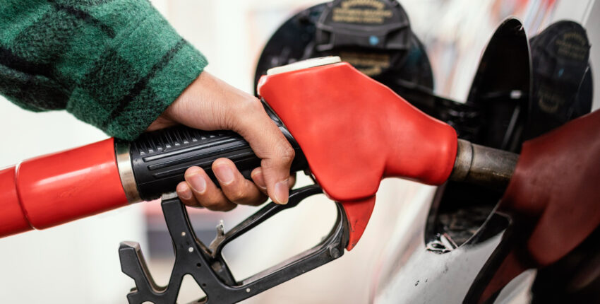A person pumping fuel into their vehicle